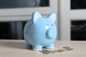 A piggy bank full of money to finance massage therapy in Sacramento 